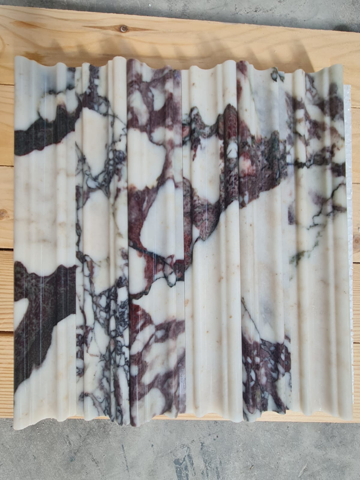 Mouldings · Calacatta Viola Extra Chair Rail · Honed natural stone moulding — surface and veining